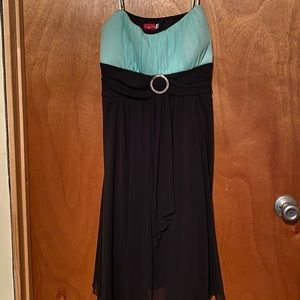 Black dress with gold ring and mint green top